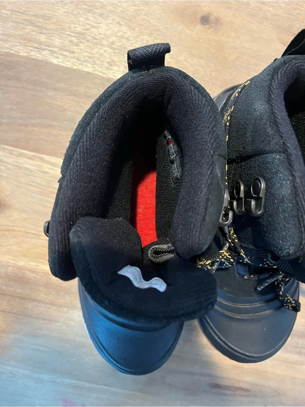 The North Face Black Boots with Yellow-Accent Laces